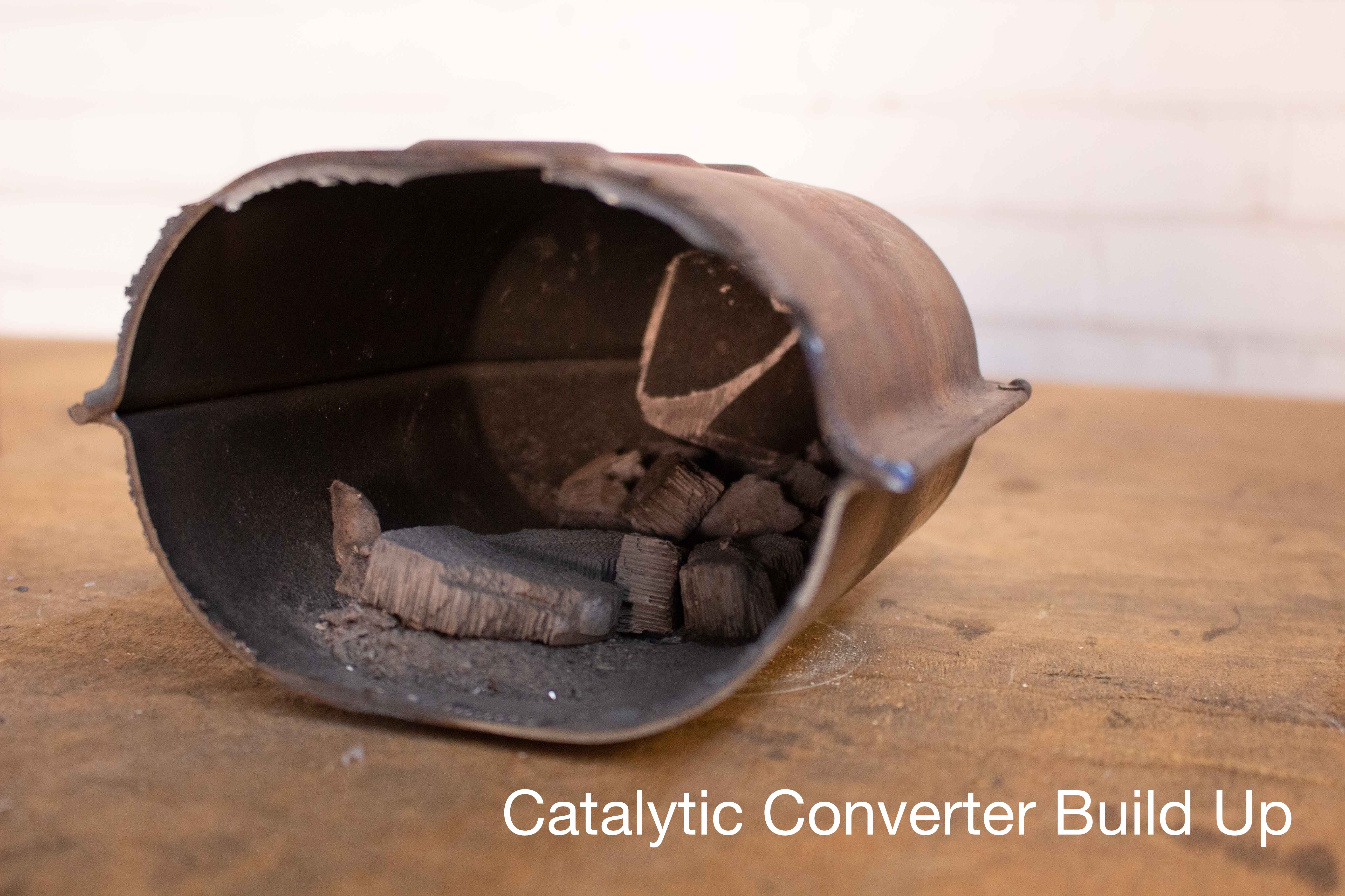 a catalytic converter filled with buildup